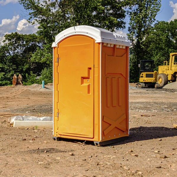 what is the cost difference between standard and deluxe portable restroom rentals in Freeman